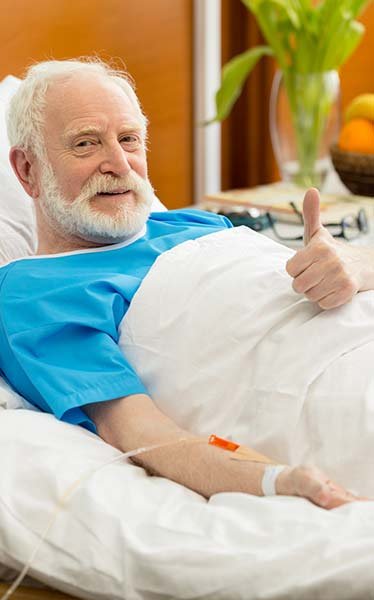 Hospital Indemnity - Old man in hospital bed